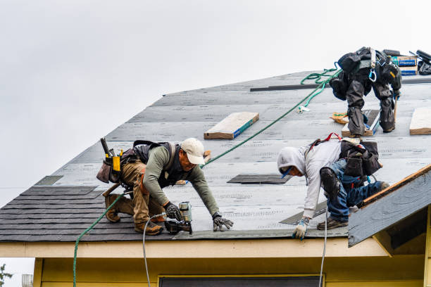 Professional Roofing technician working in Washington Mills, NY